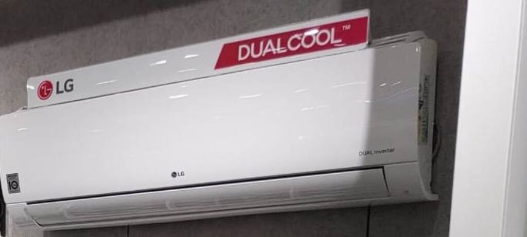 LG 1.5 Ton 5 Star DUAL Inverter Split AC 2024 model installed in a wall