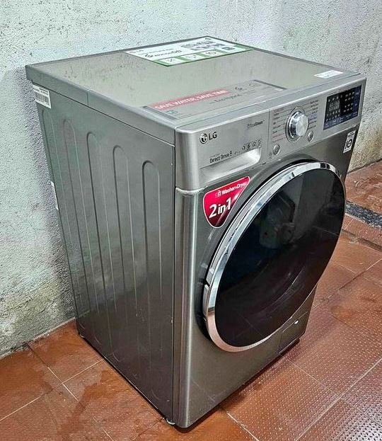 LG front load washing machine with 9kg wash and 5kg dry capacity, featuring vibration control panel